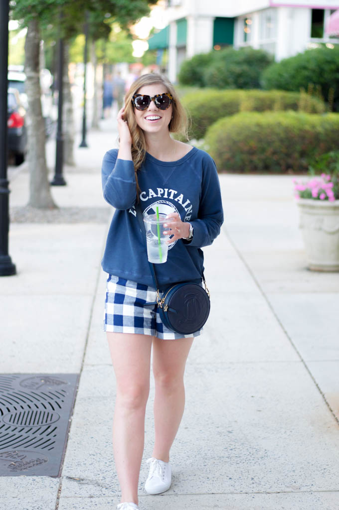 J.Crew Le Captaine Sweatshirt, Draper James Circle Handbag, Old Navy Gingham Shorts, White Canvas Sneakers, Karen Walker Number One Sunglasses, Fourth of July Outfit Inspiration