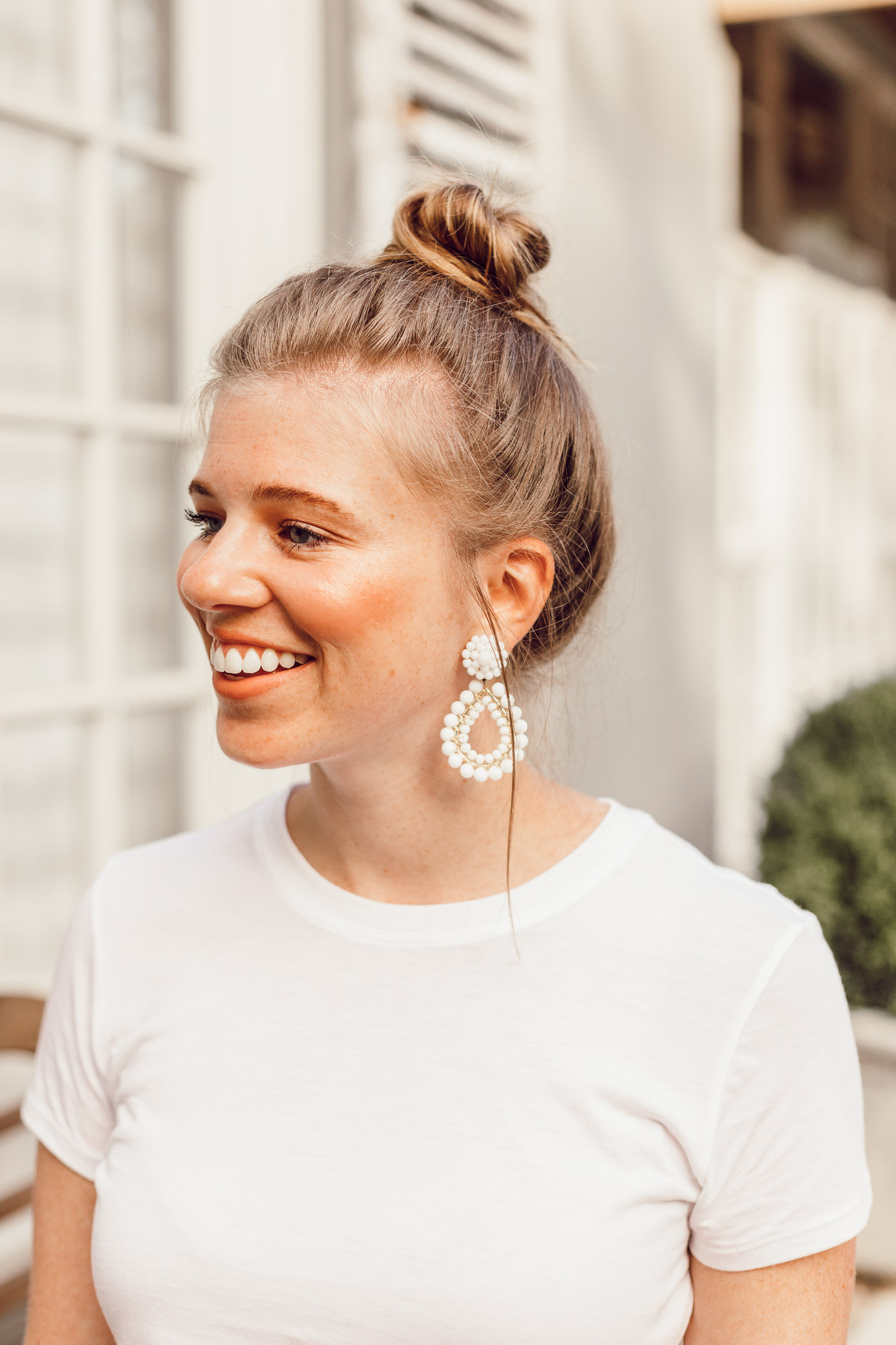 Step Out of Your Color Comfort Zone | Messy Topknot, Basic White Tee, White Statement Earrings styled on Louella Reese