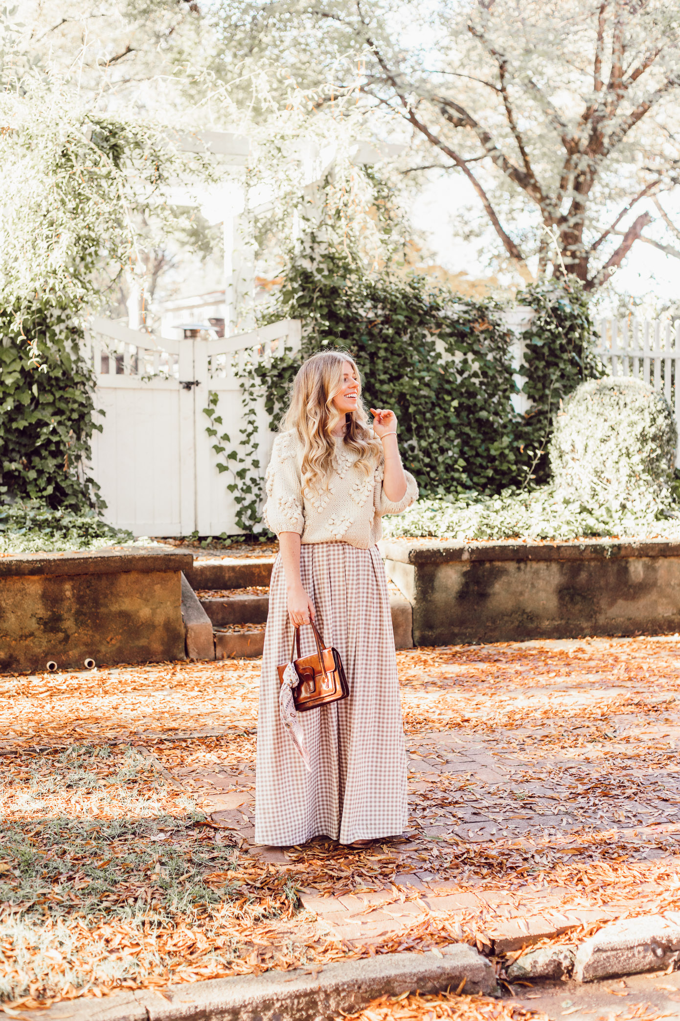 Spice Up Your Winter Date Night Look with a Winter Maxi Skirt featured on Louella Reese | Gingham Maxi Skirt, Pommed Heart Sweater