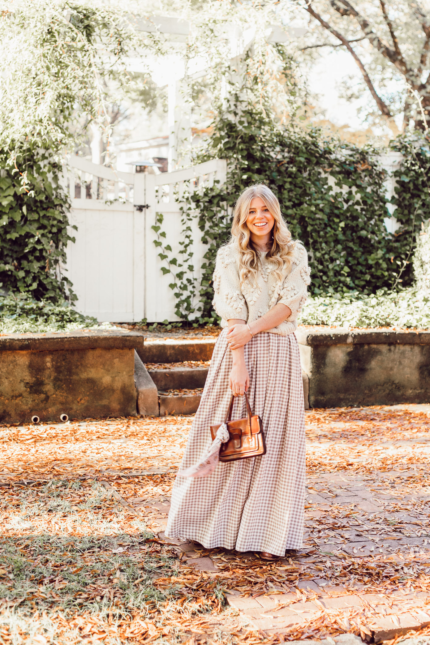 Spice Up Your Winter Date Night Look with a Winter Maxi Skirt featured on Louella Reese Life & Style Blog | Gingham Maxi Skirt, Pommed Heart Sweater
