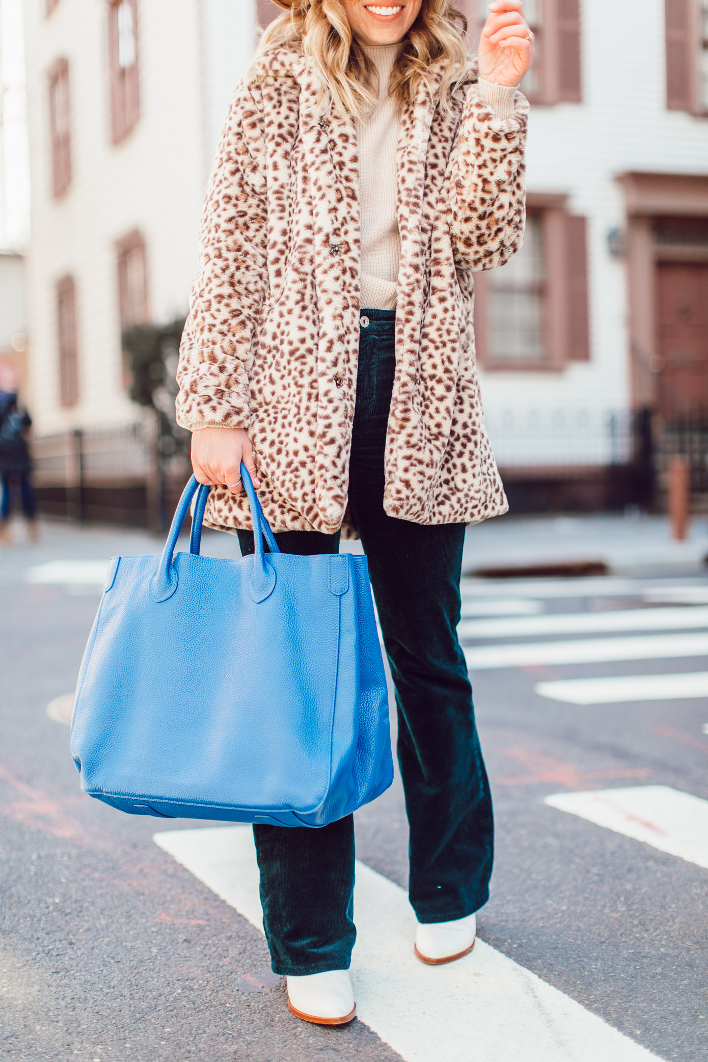 Winter Wardrobe Basics | Retro Outfit Idea - Faux Fur Leopard Coat, Corduroy Pants, Bright Blue Leather Tote, Bronze Felt Hat, White Booties featured on Louella Reese