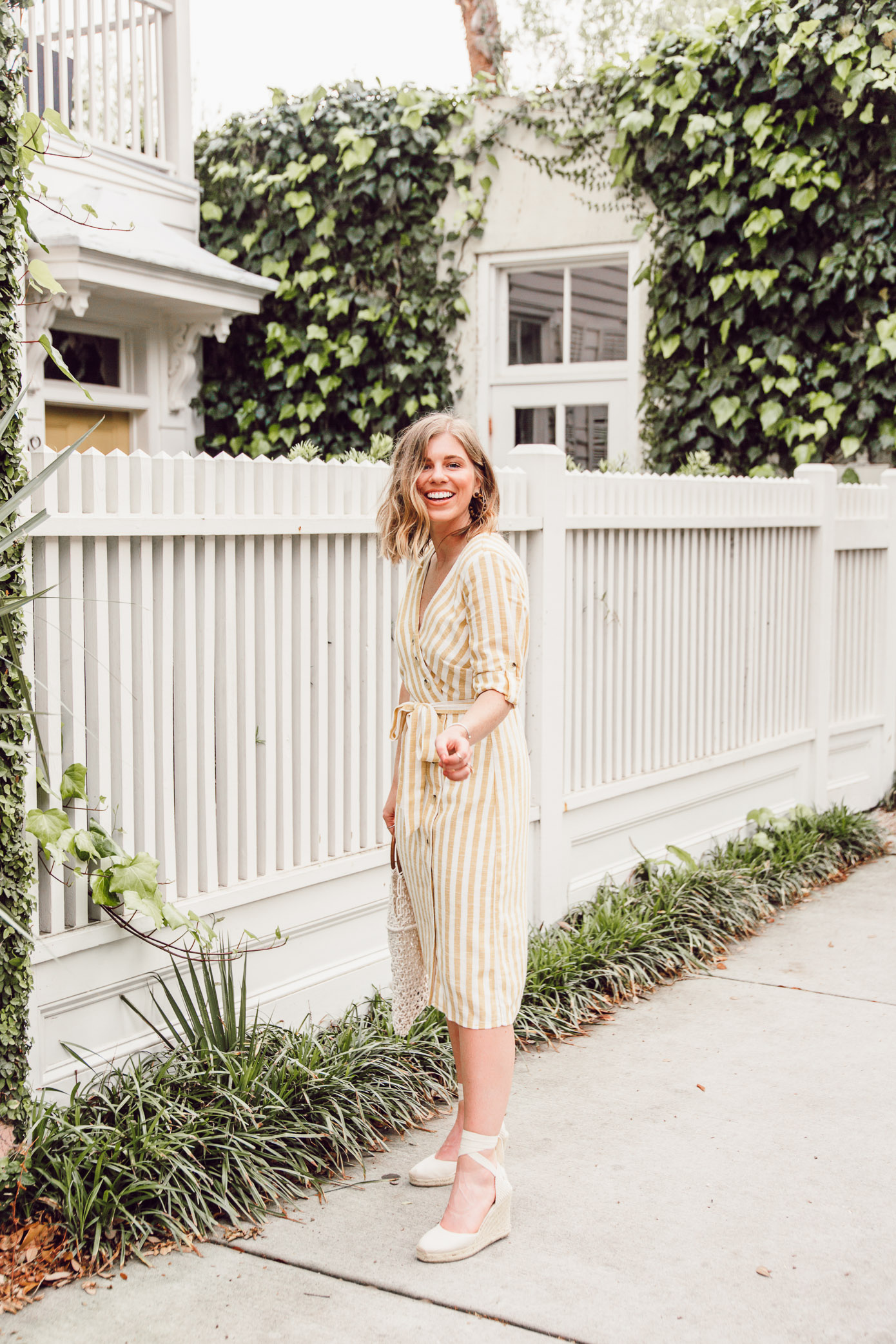 Step into spring in style in this yellow and white midi dress | Louella Reese