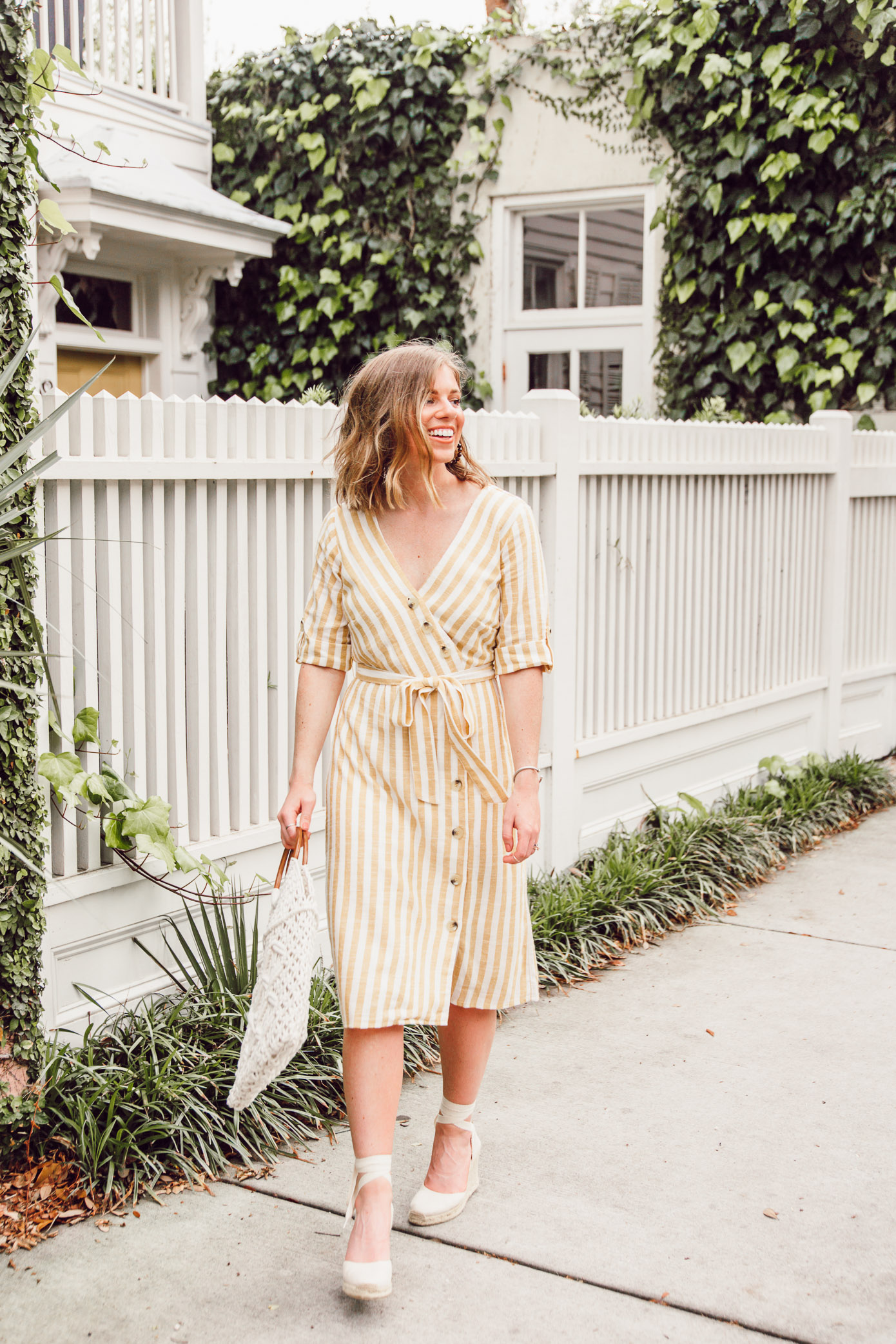 Step into spring in style in this yellow and white midi dress | Louella Reese