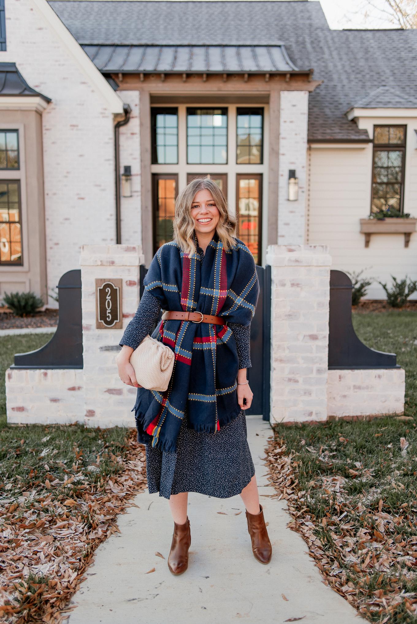 Laura Leigh of Louella Reese shares how to style a scarf as vest this winter season | navy check scarf, navy shirt dress, cognac leather chelsea boots