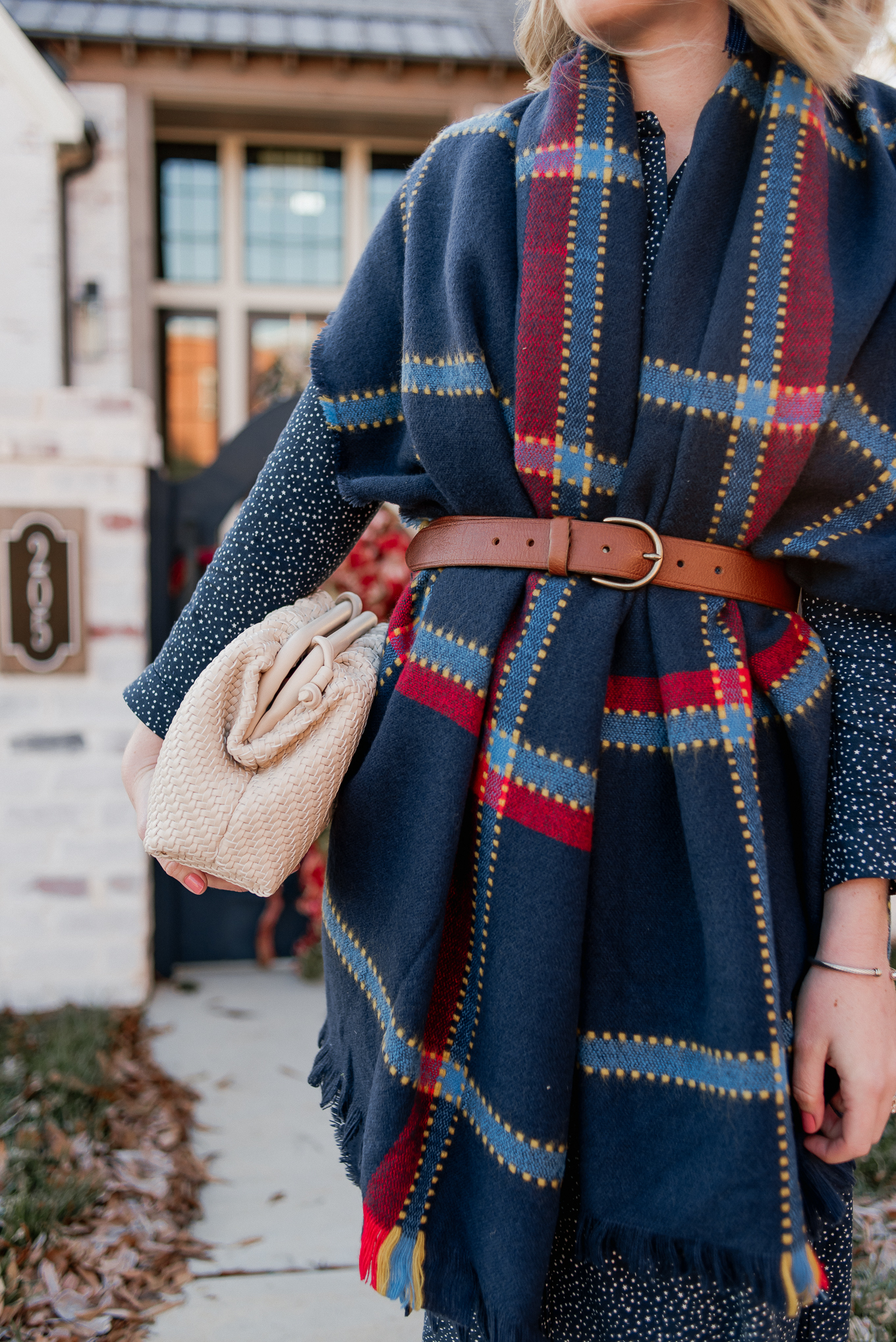 Laura Leigh of Louella Reese shares how to style a scarf as a vest this winter season plus a great BOTTEGA VENETA pouch dupe